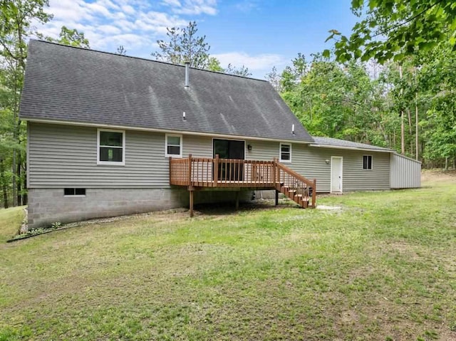 3049 Chippewa Beach Rd, Indian River, MI 49749 - rear view of house featuring a deck, a lawn, and roof with shingles