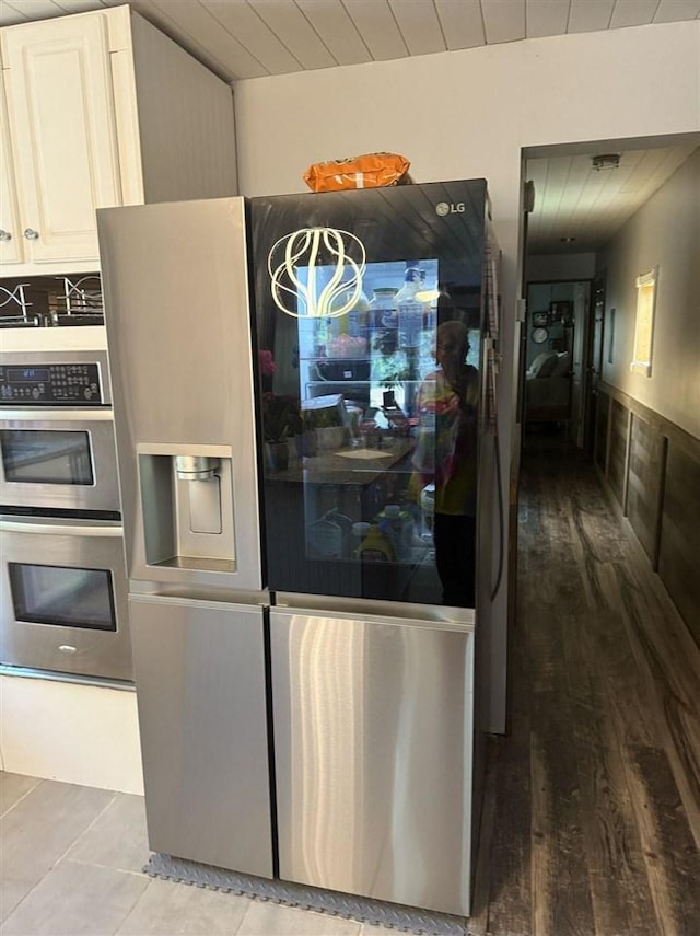 6515 Pincherry Rd, Charlevoix, MI 49720 - kitchen featuring stainless steel appliances, wood finished floors, and wooden ceiling
