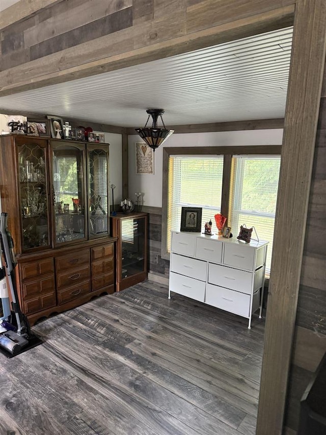 6515 Pincherry Rd, Charlevoix, MI 49720 - dining room featuring dark wood finished floors and wooden walls