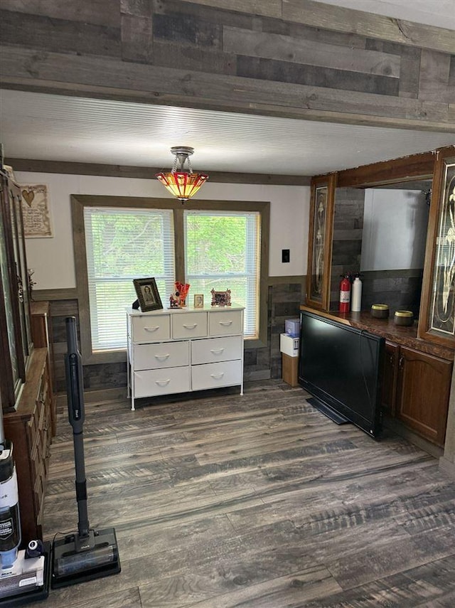 6515 Pincherry Rd, Charlevoix, MI 49720 - kitchen featuring dark wood-style flooring and a wainscoted wall