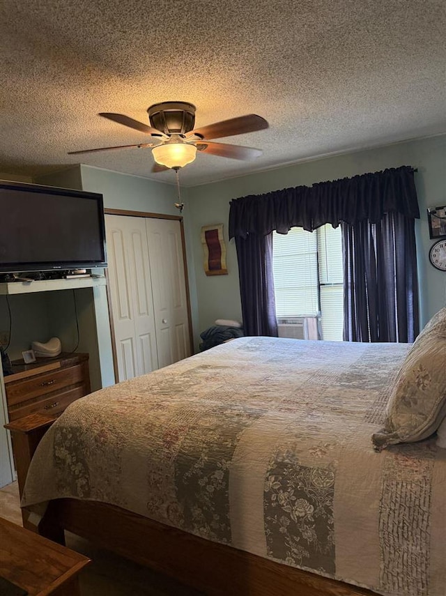 6515 Pincherry Rd, Charlevoix, MI 49720 - bedroom featuring a textured ceiling, a closet, and ceiling fan