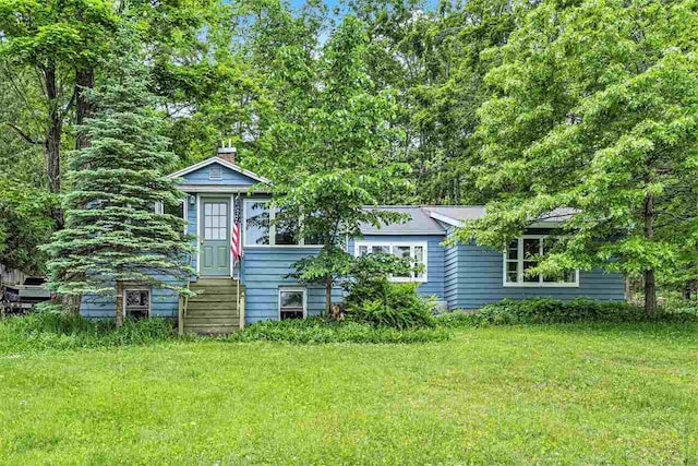 5272 Indian Garden Rd, Petoskey, MI 49770 - view of front of home with a front lawn and entry steps
