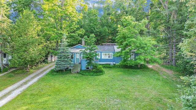 5272 Indian Garden Rd, Petoskey, MI 49770 - view of front of home featuring dirt driveway and a front yard