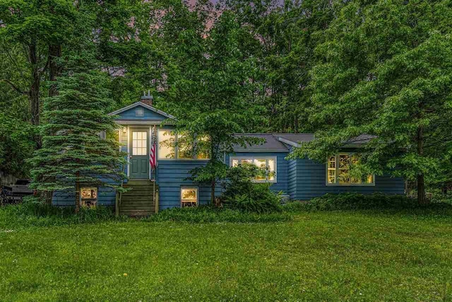 5272 Indian Garden Rd, Petoskey, MI 49770 - view of front of home with a front yard