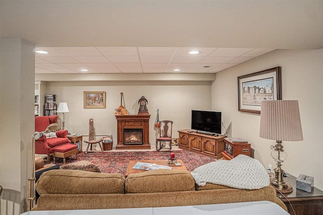 7879 Bay Meadow Dr, Harbor Springs, MI 49740 - living area featuring recessed lighting, a drop ceiling, and a lit fireplace