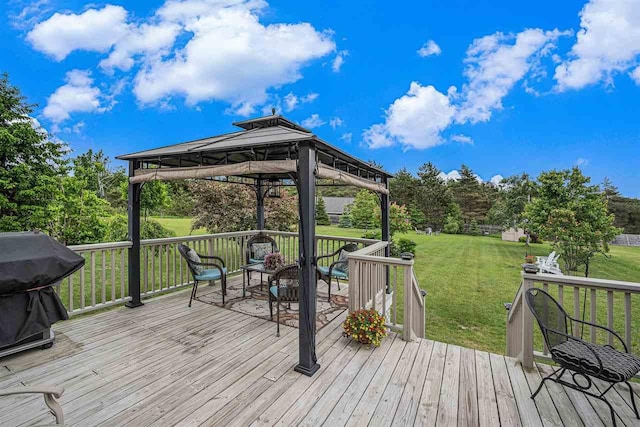 7879 Bay Meadow Dr, Harbor Springs, MI 49740 - wooden deck featuring a gazebo, area for grilling, and a lawn