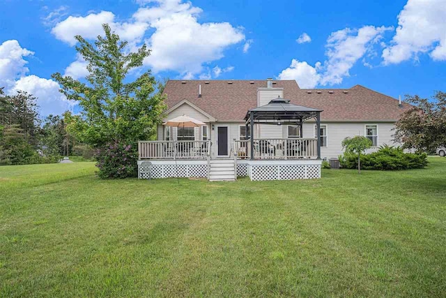 7879 Bay Meadow Dr, Harbor Springs, MI 49740 - rear view of property featuring a gazebo, a yard, a wooden deck, and a shingled roof