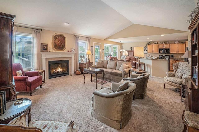 7879 Bay Meadow Dr, Harbor Springs, MI 49740 - living room with light colored carpet, lofted ceiling, a tile fireplace, and recessed lighting