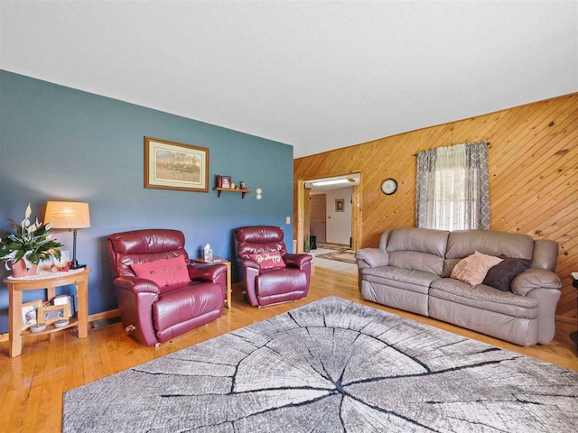 1922 Freeman Rd, East Jordan, MI 49727 - living area featuring wooden walls and wood finished floors