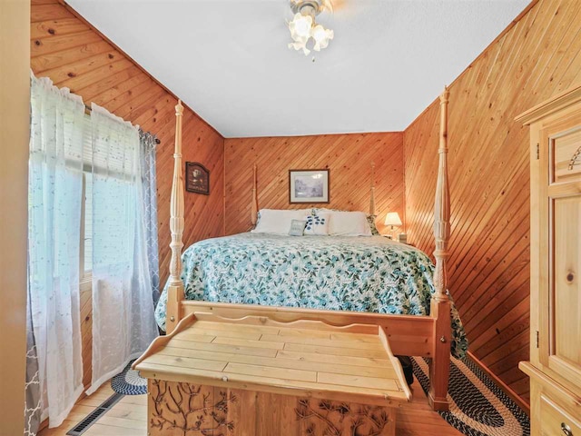 1922 Freeman Rd, East Jordan, MI 49727 - bedroom with wood walls and wood finished floors