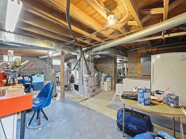 1922 Freeman Rd, East Jordan, MI 49727 - unfinished basement with electric panel, water heater, and heating unit