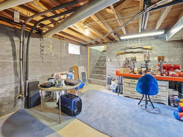 1922 Freeman Rd, East Jordan, MI 49727 - basement with a workshop area and stairs