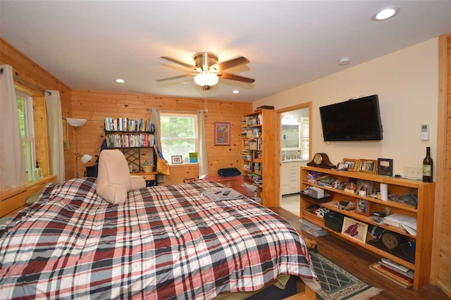 1340 Zink Rd, Boyne City, MI 49712 - bedroom with wood finished floors, wood walls, and recessed lighting