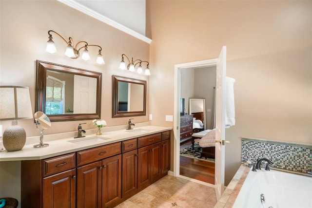 690 Woodhill Unit 6, Harbor Springs, MI 49740 - bathroom with double vanity, a tub with jets, and ensuite bathroom
