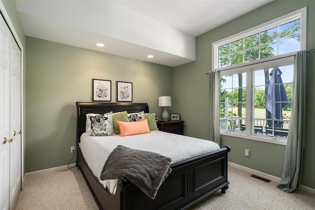 690 Woodhill Unit 6, Harbor Springs, MI 49740 - bedroom with light colored carpet, recessed lighting, and a closet