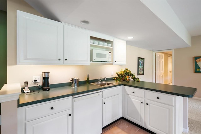 690 Woodhill Unit 6, Harbor Springs, MI 49740 - kitchen with white appliances, a peninsula, dark countertops, white cabinets, and recessed lighting