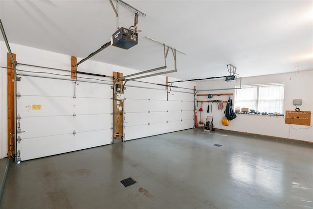 690 Woodhill Unit 6, Harbor Springs, MI 49740 - garage featuring a garage door opener