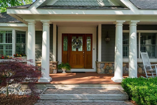 690 Woodhill Unit 6, Harbor Springs, MI 49740 - entrance to property featuring covered porch and stone siding