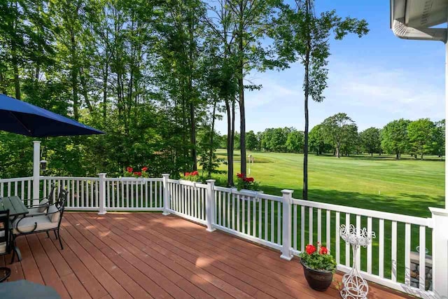 690 Woodhill Unit 6, Harbor Springs, MI 49740 - wooden deck with a yard and view of scattered trees