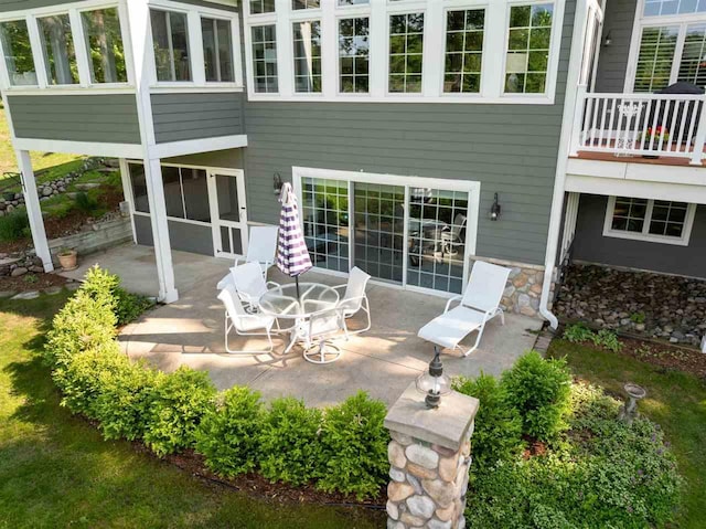 690 Woodhill Unit 6, Harbor Springs, MI 49740 - rear view of property with a patio