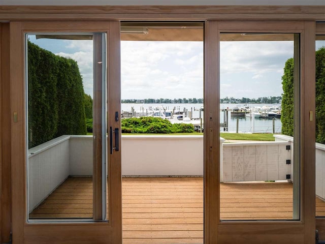 528 E Bay St Unit 30, Harbor Springs, MI 49740 - doorway to outside featuring a water view and healthy amount of natural light