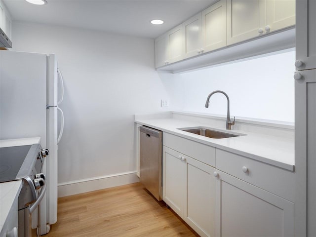 528 E Bay St Unit 30, Harbor Springs, MI 49740 - kitchen featuring stainless steel appliances, light wood-type flooring, light countertops, recessed lighting, and white cabinets