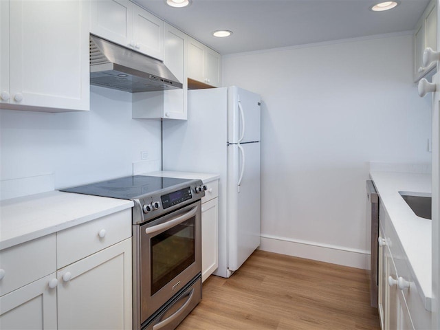528 E Bay St Unit 30, Harbor Springs, MI 49740 - kitchen with stainless steel range with electric cooktop, under cabinet range hood, white cabinets, light wood-style flooring, and recessed lighting
