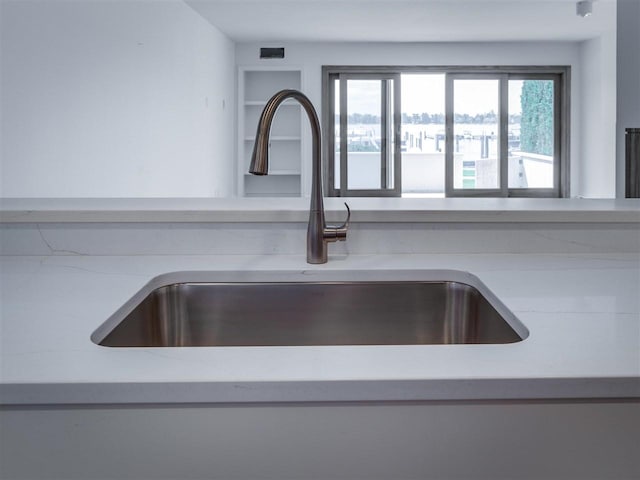528 E Bay St Unit 30, Harbor Springs, MI 49740 - kitchen view of a sink and light countertops