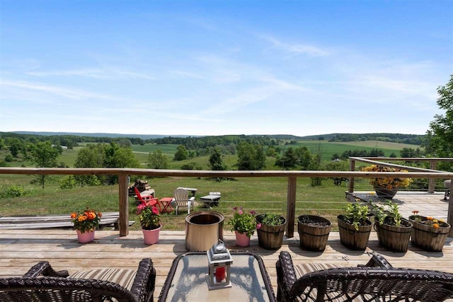 9235 Bailey Rd, East Jordan, MI 49727 - view of wooden balcony featuring a view of countryside and a deck