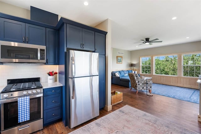 9235 Bailey Rd, East Jordan, MI 49727 - kitchen featuring appliances with stainless steel finishes, open floor plan, dark wood-style flooring, ceiling fan, and recessed lighting
