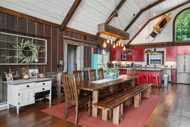 9235 Bailey Rd, East Jordan, MI 49727 - dining space featuring a wood ceiling with exposed beams, dark wood-style floors, wooden walls, and high vaulted ceiling
