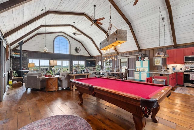 9235 Bailey Rd, East Jordan, MI 49727 - game room with hardwood / wood-style flooring, ceiling fan, high vaulted ceiling, pool table, and a wood ceiling with exposed beams