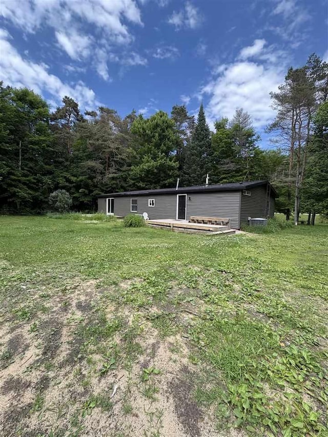 5117 Korthase Rd, Boyne City, MI 49712 - back of house with a lawn