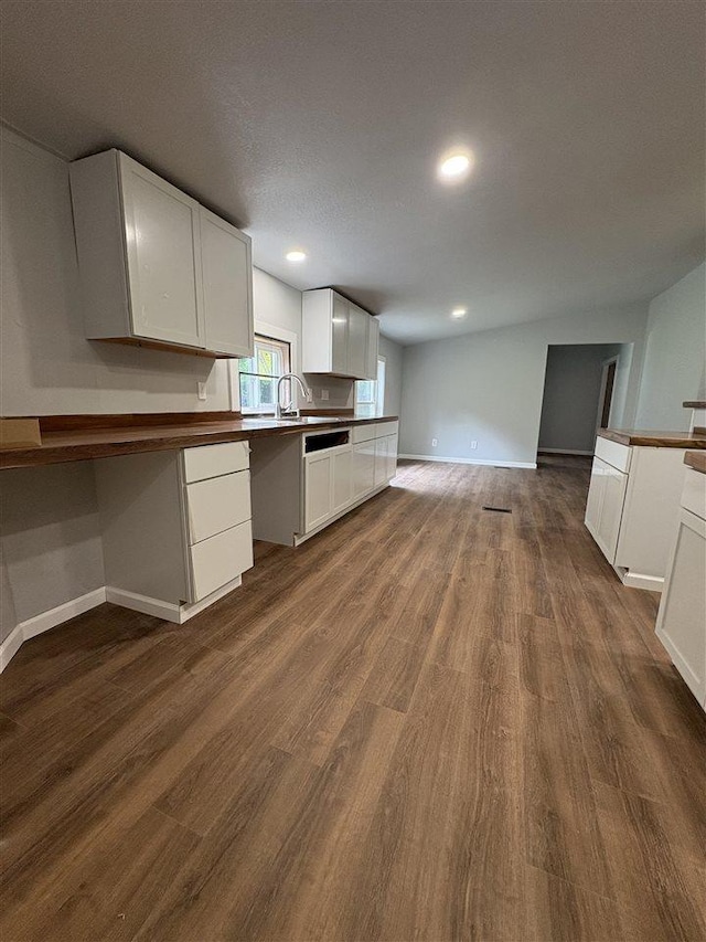 5117 Korthase Rd, Boyne City, MI 49712 - kitchen with white cabinetry, dark wood-style floors, open floor plan, recessed lighting, and dishwasher