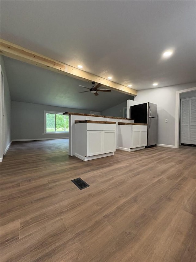 5117 Korthase Rd, Boyne City, MI 49712 - kitchen with recessed lighting, white cabinets, open floor plan, a ceiling fan, and wood finished floors