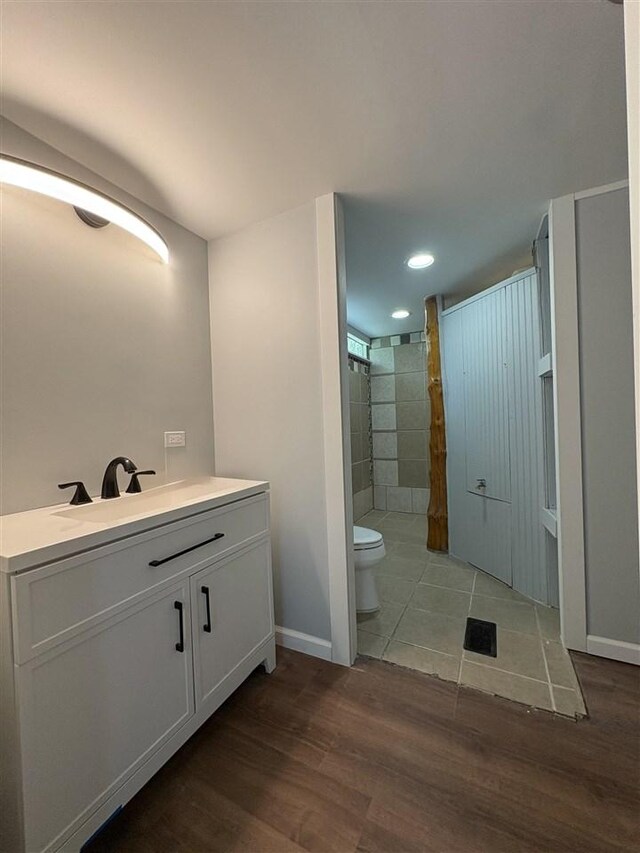 5117 Korthase Rd, Boyne City, MI 49712 - full bath featuring wood finished floors, vanity, and recessed lighting