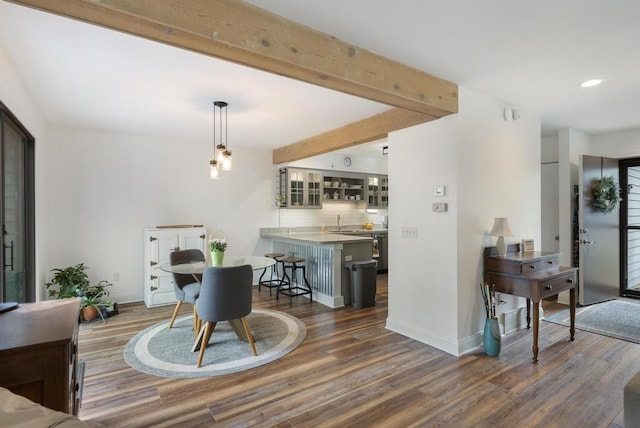 1185 Hideaway Valley Dr Unit 60, Harbor Springs, MI 49740 - dining area featuring wood finished floors, beam ceiling, and recessed lighting
