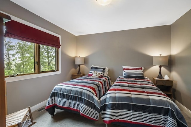 1185 Hideaway Valley Dr Unit 60, Harbor Springs, MI 49740 - bedroom featuring baseboards and carpet floors