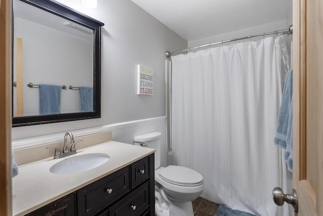 1185 Hideaway Valley Dr Unit 60, Harbor Springs, MI 49740 - full bath featuring vanity, wainscoting, a shower with shower curtain, and tile patterned floors