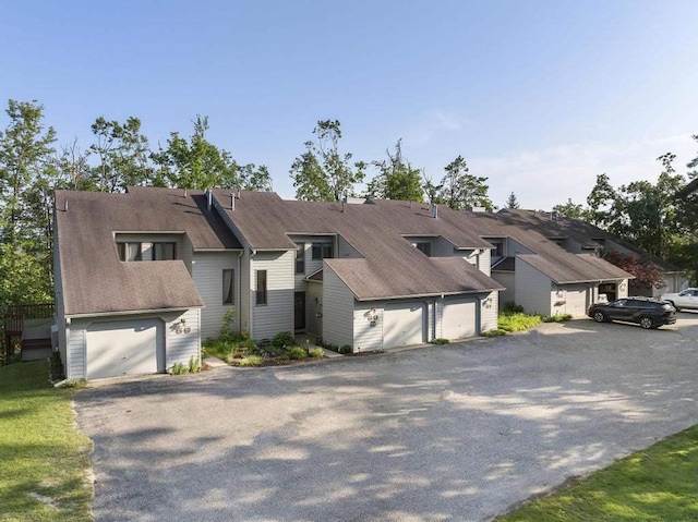 1185 Hideaway Valley Dr Unit 60, Harbor Springs, MI 49740 - view of front of house with asphalt driveway