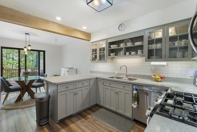 1185 Hideaway Valley Dr Unit 60, Harbor Springs, MI 49740 - kitchen with a peninsula, gray cabinetry, dark wood finished floors, light countertops, and beam ceiling