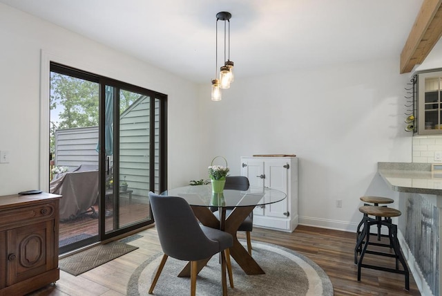 1185 Hideaway Valley Dr Unit 60, Harbor Springs, MI 49740 - dining room with wood finished floors and beamed ceiling