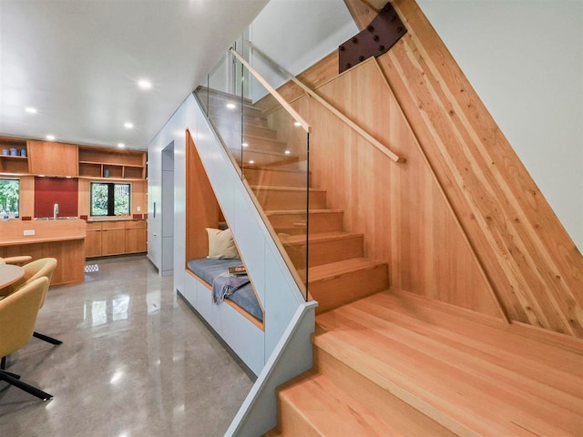 5277 Tyrol Ln, Harbor Springs, MI 49740 - stairway with wood walls and recessed lighting