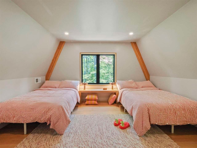 5277 Tyrol Ln, Harbor Springs, MI 49740 - bedroom with wood finished floors, recessed lighting, and vaulted ceiling