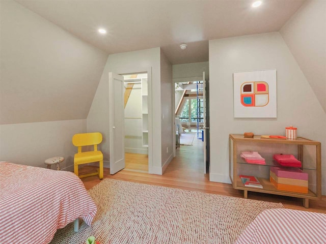 5277 Tyrol Ln, Harbor Springs, MI 49740 - bedroom featuring wood finished floors, recessed lighting, and vaulted ceiling
