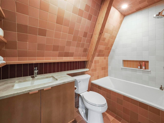 5277 Tyrol Ln, Harbor Springs, MI 49740 - bathroom with tile walls, vanity, tile patterned floors, recessed lighting, and lofted ceiling