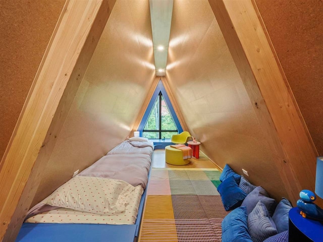 5277 Tyrol Ln, Harbor Springs, MI 49740 - bedroom featuring lofted ceiling and wood finished floors