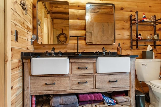 899 S State Rd, Harbor Springs, MI 49740 - bathroom featuring double vanity and wooden walls