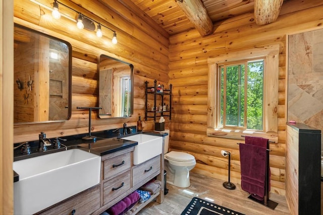 899 S State Rd, Harbor Springs, MI 49740 - bathroom featuring double vanity, wood finished floors, and a wooden ceiling with exposed beams