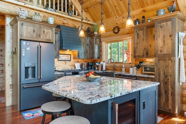 899 S State Rd, Harbor Springs, MI 49740 - kitchen featuring high end refrigerator, wine cooler, exhaust hood, a wooden ceiling with exposed beams, and rustic walls